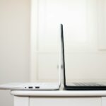 black and white laptop on table back to back